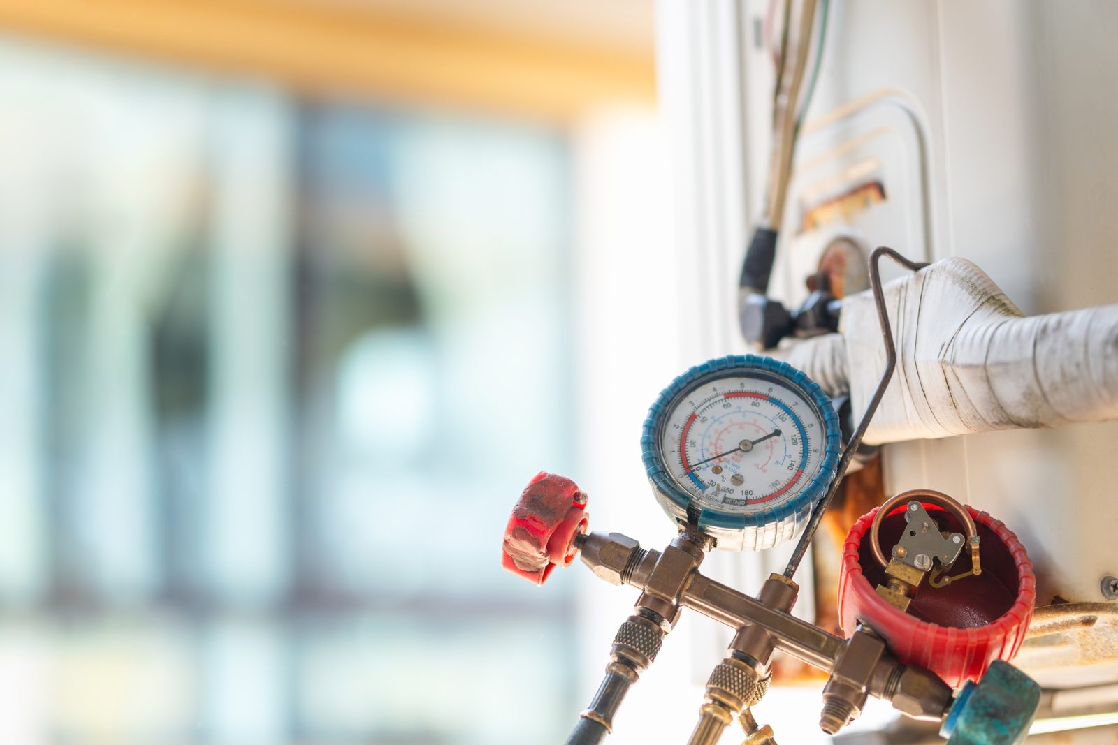 Manifold gauges connected to an HVAC system